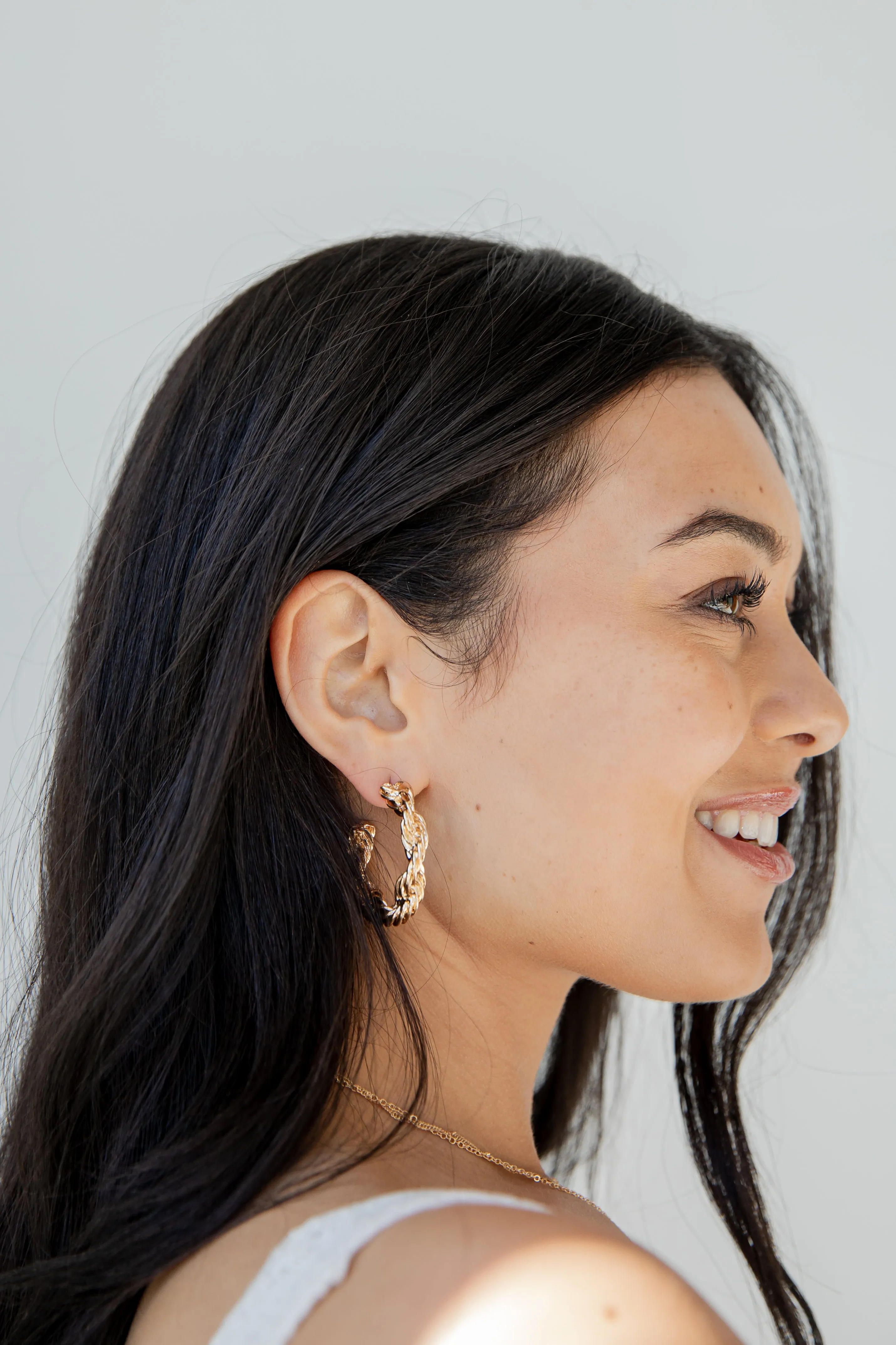 Raven Gold Twisted Hoop Earrings